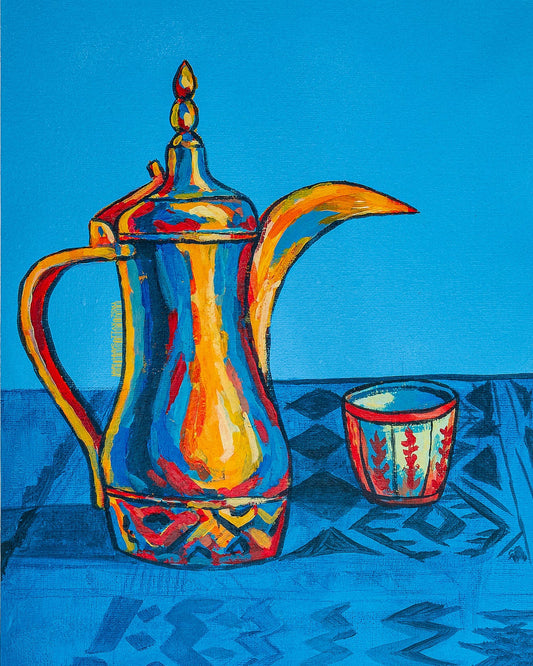 Decorative teapot and cup on a blue patterned surface with a blue background