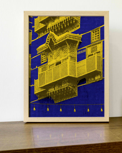 Framed artwork with gold architectural design on a blue background