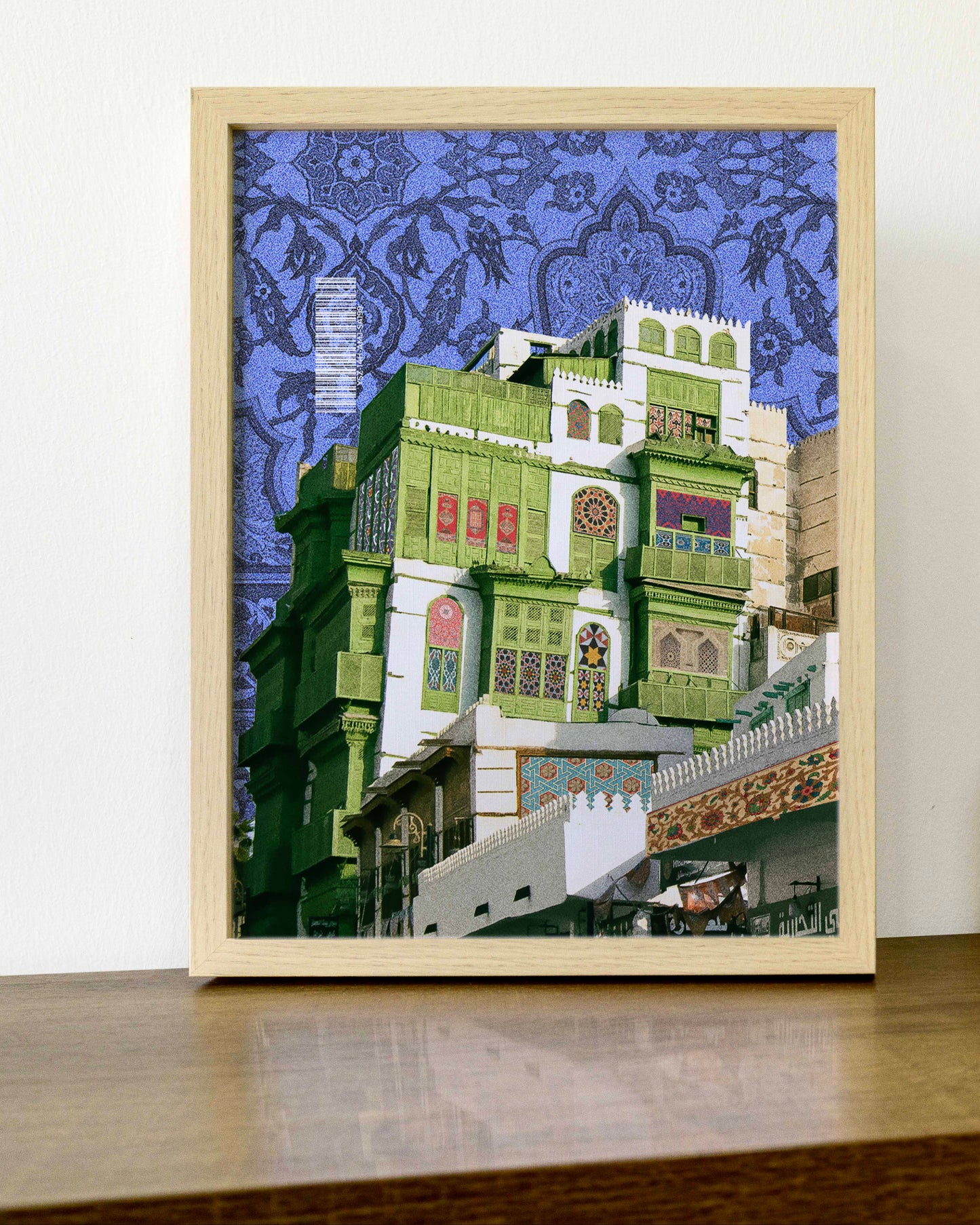 Decorative collage of a Al Balad building with intricate patterns on a blue background. Printed Artwork