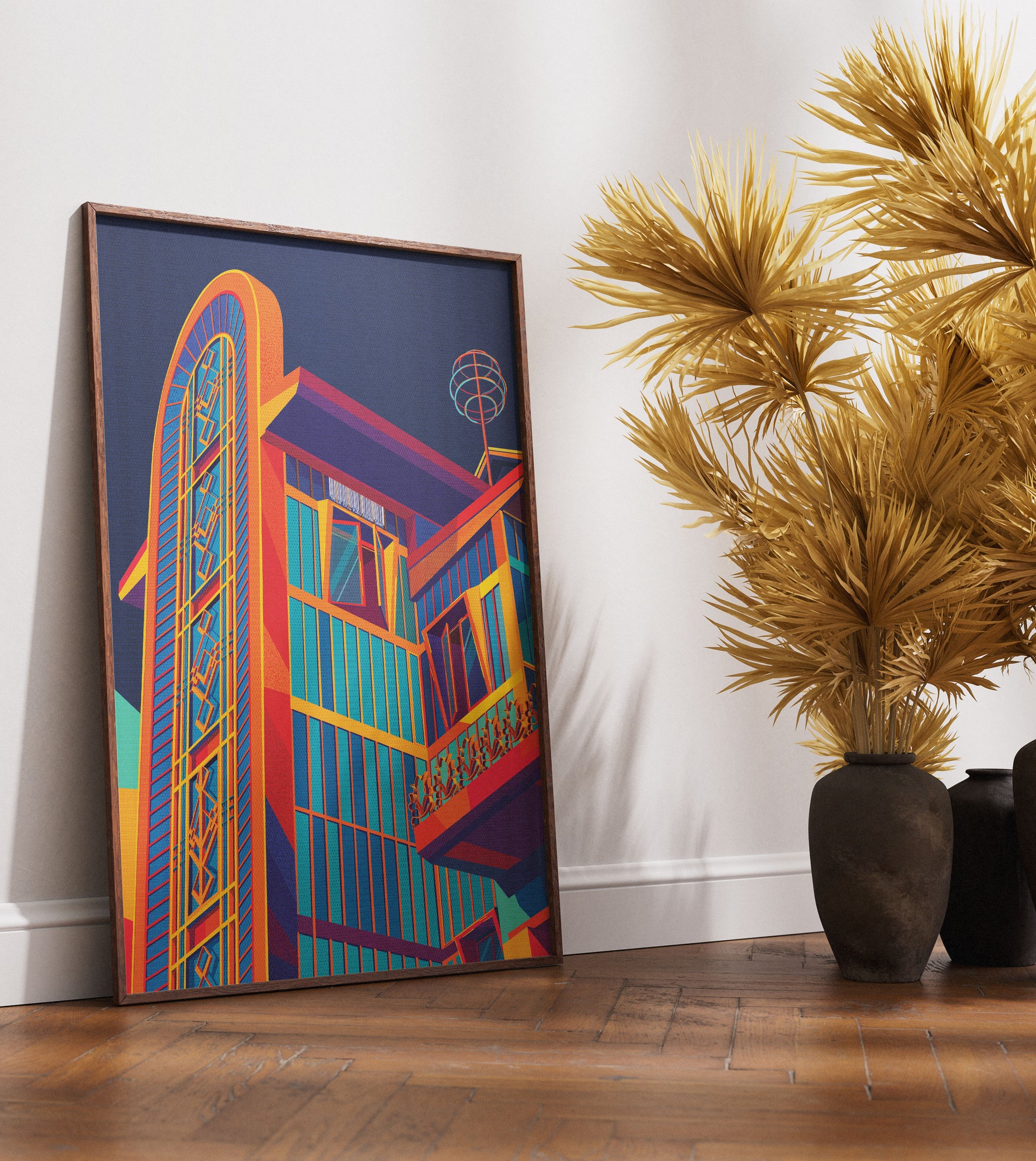 Colorful abstract painting of a building on a wall next to a potted plant.